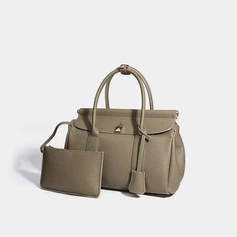 Taupe leather women’s bucket tote bag with matching pouch, stylish and practical everyday accessory.