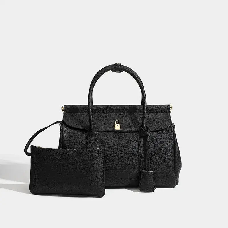 Black leather women's tote bag with matching pouch, elegant and functional for everyday use.