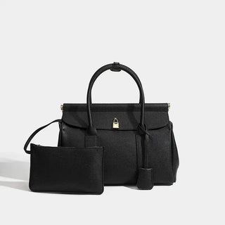 Black leather women's tote bag with matching pouch, elegant and functional for everyday use.
