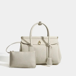 Taupe leather women’s tote bag with matching pouch, stylish and practical for everyday use.