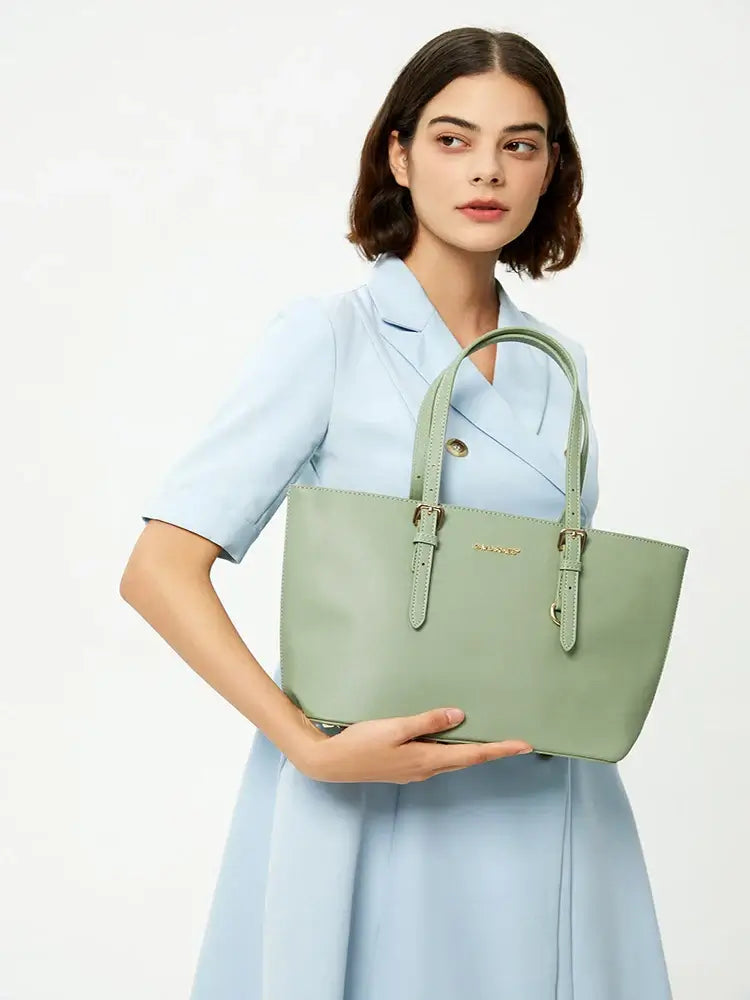 Tote Bag with Adjustable Shoulder Straps in light green color held by a model wearing a blue dress.