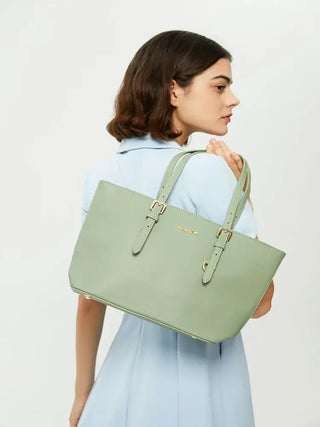 Tote Bag with adjustable shoulder straps in light green color, model holding the bag, stylish and versatile design.