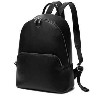 Vintage backpack for women in black soft faux leather with criss-cross design and zipper closure.