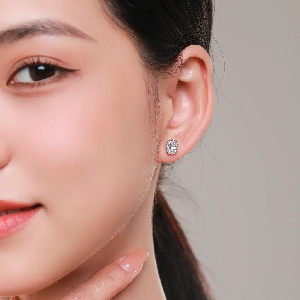 Water Drop Zircon Stud Earrings Set 925 Sterling Silver worn by a model, showcasing sparkling zircon stones.