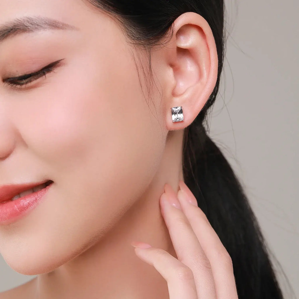 Water Drop Zircon Stud Earrings Set 925 Sterling Silver worn by a model, showcasing elegance and style.