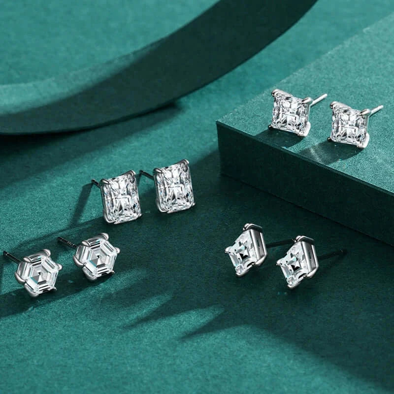 Water Drop Zircon Stud Earrings Set 925 Sterling Silver displayed on a green background, featuring multiple elegant designs.
