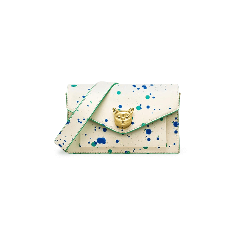 White crossbody bag with paint splatter design and gold fox emblem, crafted from genuine cowhide leather.