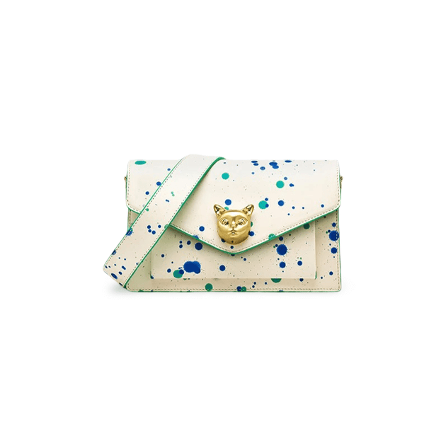 White crossbody bag with paint splatter design and gold fox emblem, crafted from genuine cowhide leather.