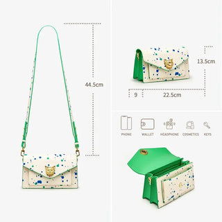 White crossbody bag with paint splatter design, gold fox emblem, dimensions 44.5cm x 22.5cm x 13.5cm.