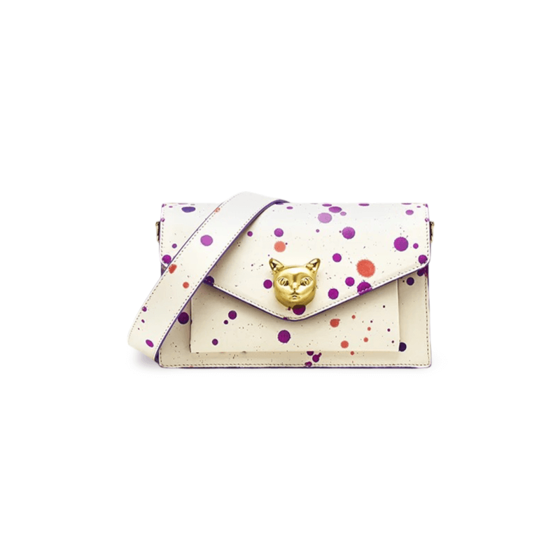 White women’s crossbody bag with paint splatter design and gold fox emblem, stylish and versatile for everyday use.