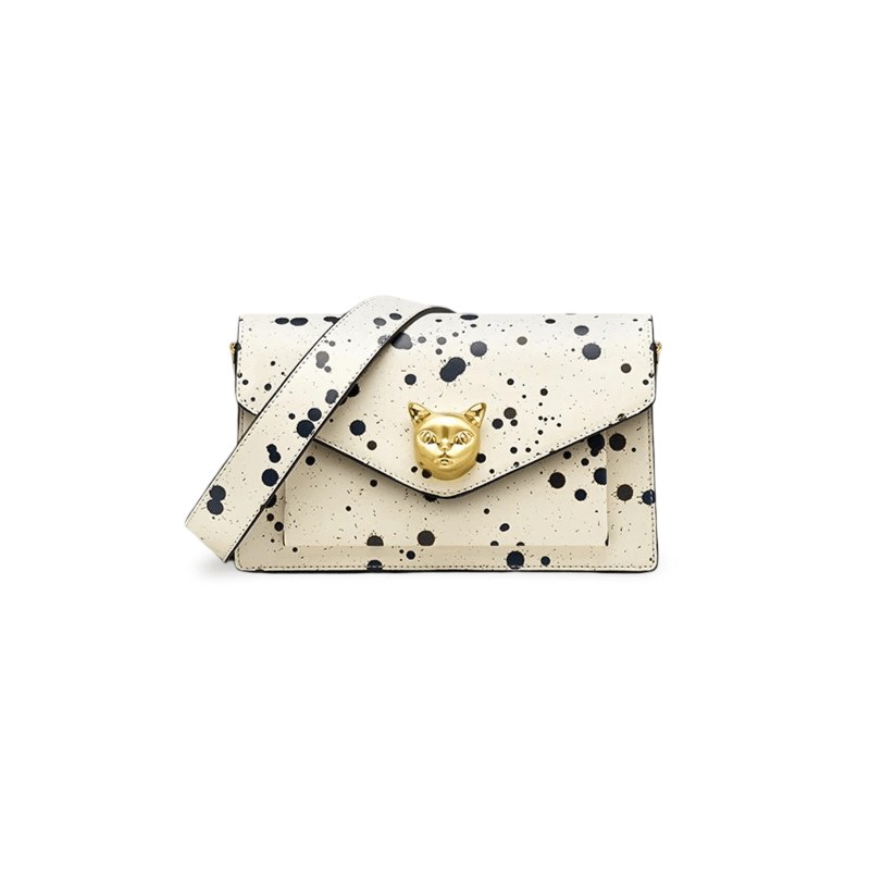 White crossbody bag with paint splatter design and gold fox emblem, crafted from genuine cowhide leather.