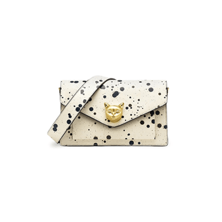 White crossbody bag with paint splatter design and gold fox emblem, crafted from genuine cowhide leather.
