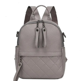 Gray quilted leather backpack for women, stylish and functional with dual zippers and adjustable straps.
