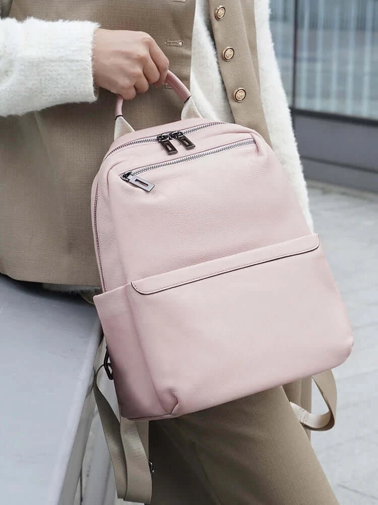 Pink leather backpack for women, stylish and practical, perfect for daily use and organized storage.