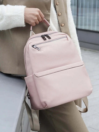 Pink leather backpack for women, stylish and practical, perfect for daily use and organized storage.