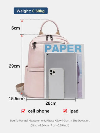 Pink leather backpack showcasing dimensions, designed for women with stylish functionality and organized storage.
