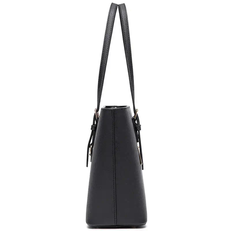 Women's classic black faux leather tote bag with adjustable handles, stylish and versatile for various occasions.