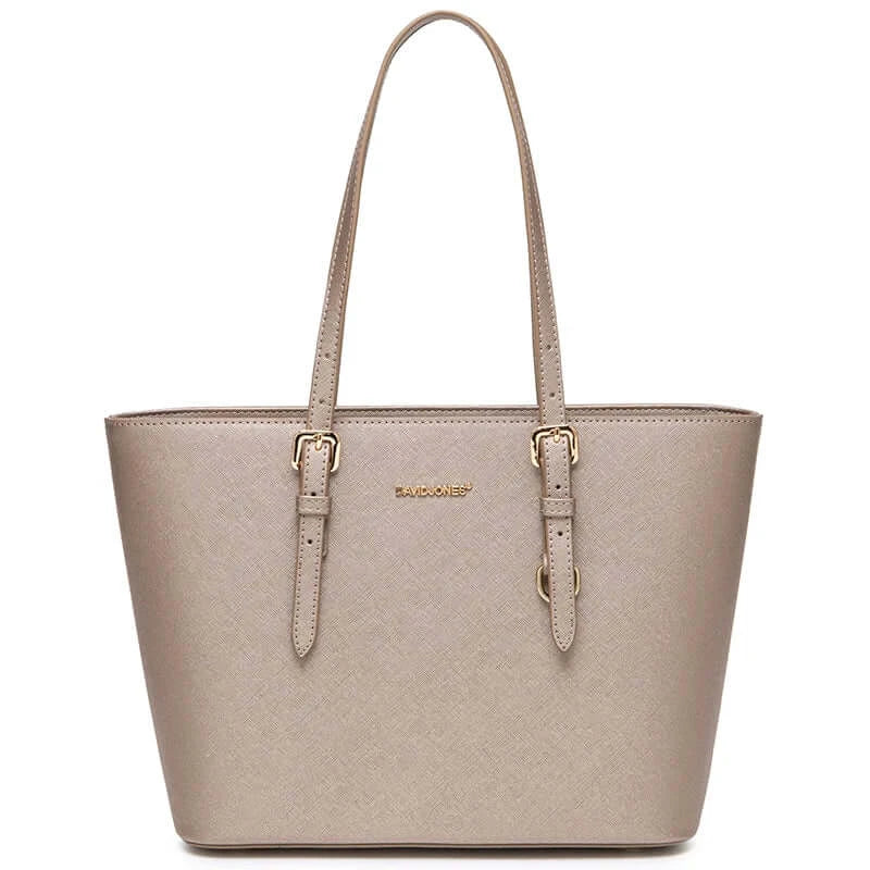 Women's tote bag in soft beige faux leather with adjustable handles and zipper closure, perfect for casual occasions.