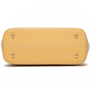 Bottom view of yellow tote bag with metal feet, stylish and durable, perfect for everyday use.