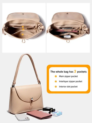 Leather crossbody bag in beige with three pockets for organization, showcasing a minimalist design and structured style.
