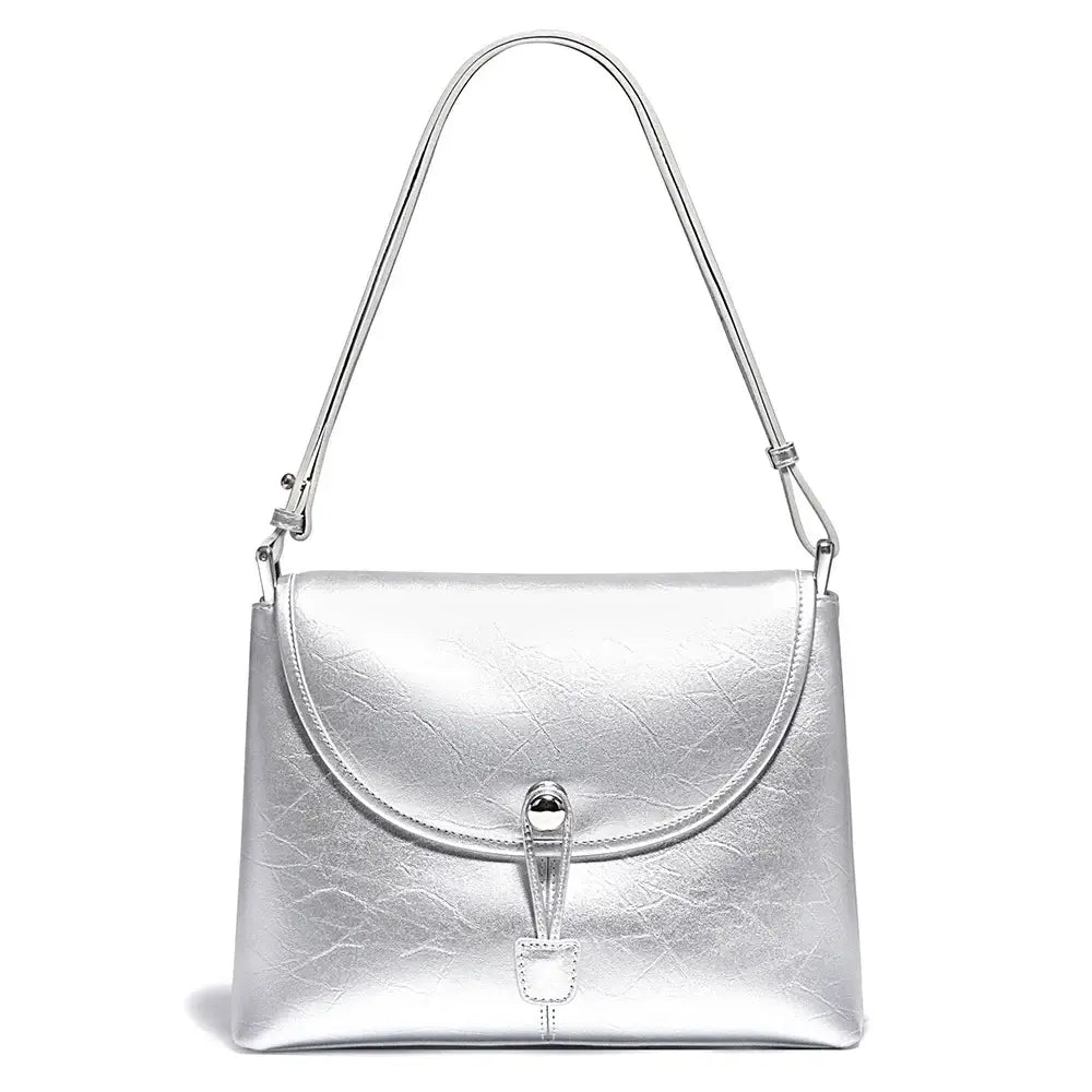Silver leather crossbody bag with a stylish envelope design and secure closure.
