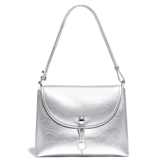 Silver leather crossbody bag with a stylish envelope design and secure closure.