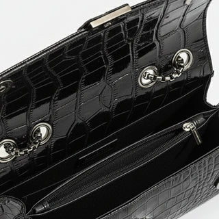 Black crossbody bag interior with chain detail and zip pocket, crafted from high-quality PU leather.