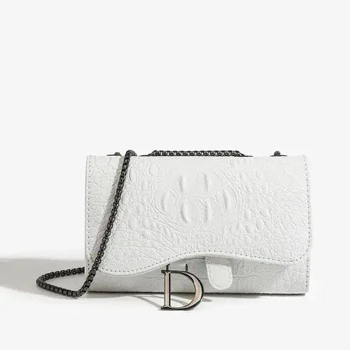 White crossbody bag in textured PU leather with chain strap and chic clasp, perfect for stylish outings.