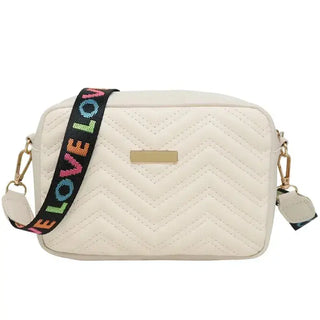 Beige quilted women’s crossbody bag with colorful strap for stylish daily wear