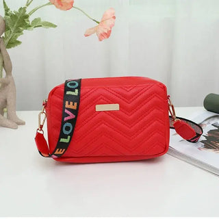 Red Quilted Women’s Crossbody Bag with Colorful Strap, stylish accessory for everyday use.