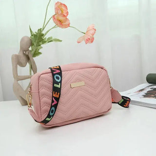 Beige quilted women's crossbody bag with colorful strap, stylish accessory for daily essentials.
