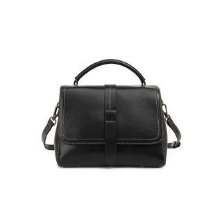 Black crossbody bag, elegant genuine leather flap bag for women with dual straps and rivet accents.