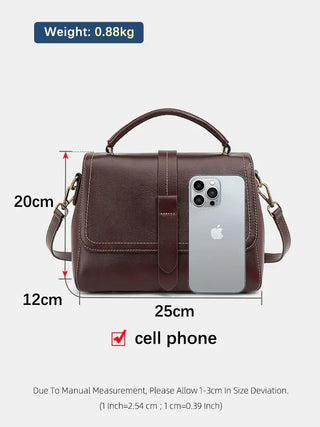 Crossbody Bag Black, elegant handmade leather bag, includes measurement details and a smartphone for size reference.