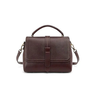Elegant crossbody bag in dark brown genuine leather with dual straps and chic metallic accents.