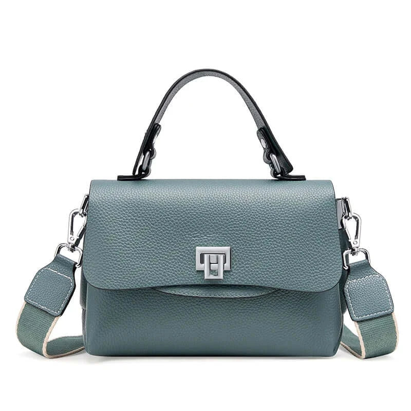 Crossbody bag in teal, leather handbag with stylish lock detail for women, perfect for everyday elegance.