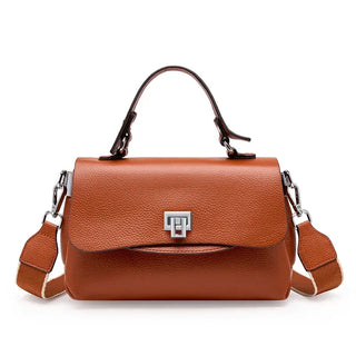 Handmade brown leather handbag with a structured design and silver lock closure, perfect for stylish women.