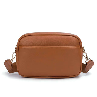 Crossbody bag with wide adjustable strap made of high-quality PU leather in a tan color.