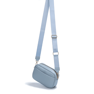 Crossbody bag with wide adjustable strap in light blue, made of durable PU leather for stylish everyday use.