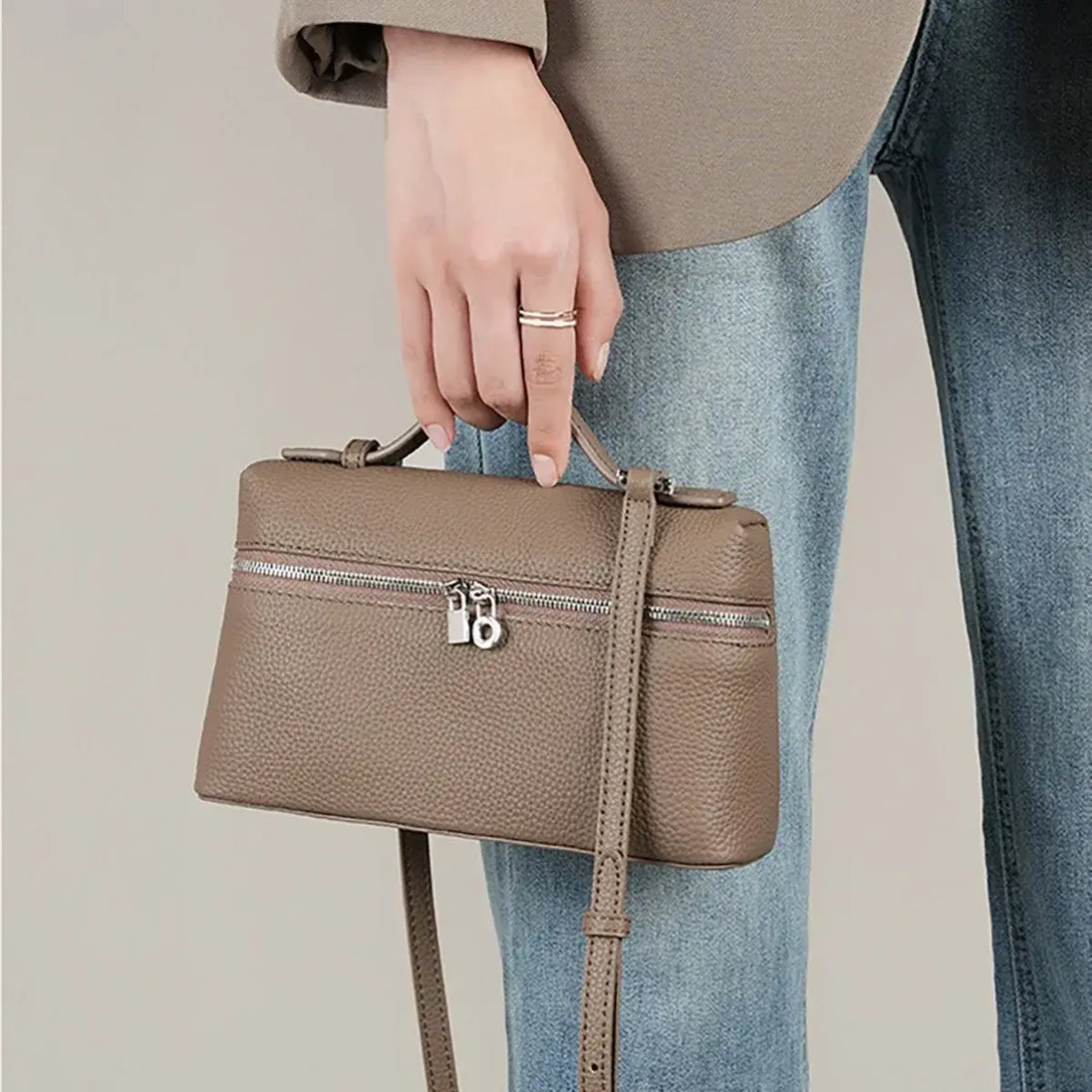 Brown PU leather mini crossbody bag with zipper, perfect for casual everyday wear.