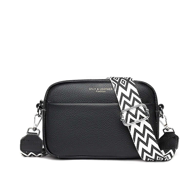 Women’s black crossbody bag made of genuine leather with geometric adjustable strap, ideal for fashion lovers.