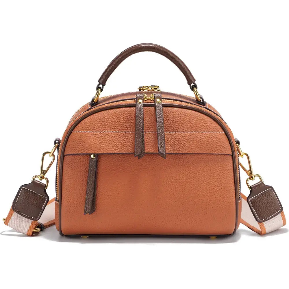 Orange leather shoulder bag with structured design and detachable strap, featuring rivet accents and multiple compartments.