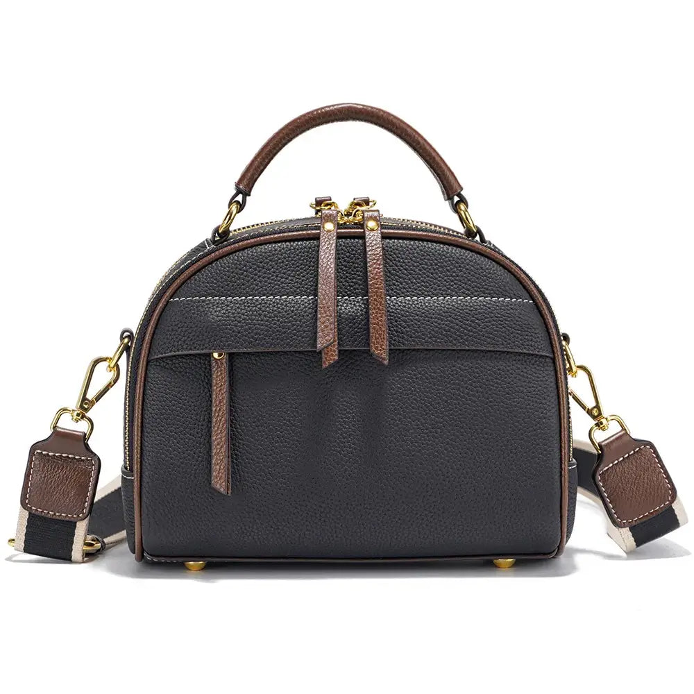 Chic structured shoulder bag in gray and brown leather with versatile compartments and modern rivet detailing.
