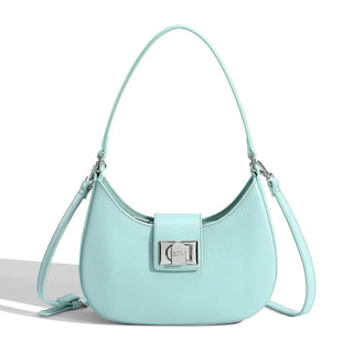 Women's shoulder bag in mint navy blue faux leather with metal clasp, featuring soft construction and versatile design.