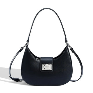Women's shoulder bag in black faux leather with metal clasp, featuring a stylish half moon design.