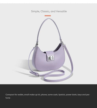 Women's shoulder bag in purple faux leather with metal clasp, compact design for essentials.