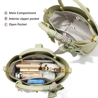 Light green leather handbag interior showing main compartment, interior zipper pocket, and open pocket.