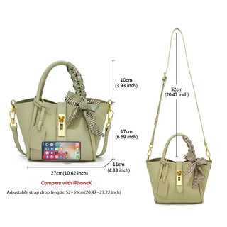 Light green leather women’s handbag with gold lock, scarf detail, and adjustable crossbody strap dimensions.