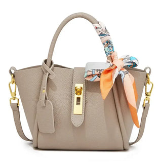 Light Green Leather Handbag with Gold Lock, Scarf Detail, and Crossbody Strap, Vintage Style