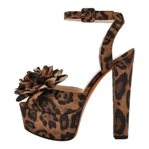 Leopard print high heels for women with ankle strap and flower detail, stylish platform sandals.