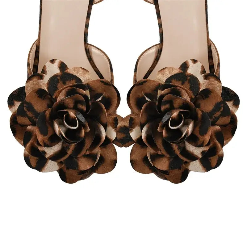 High heels for women in brown leopard print with floral embellishments, perfect for bold fashion statements.